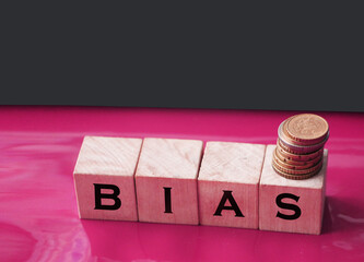 the word bias on wooden blocks on red. Social concept