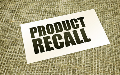 card with text PRODUCT RECALL on burlap canvas. business concept