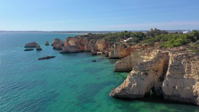 Delightful aerial view of Portuguese rocky beaches near the city of Portimao. For the rest of tourists. Algarve.