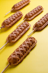 waffles sticks plains on yellow background. making patterns