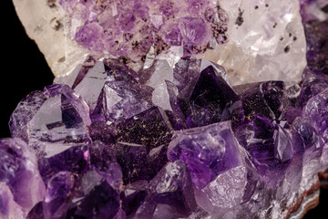 Fototapeta premium macro mineral amethyst stone with calcite black background