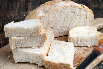 sliced pieces of gray bread from second-rate flour