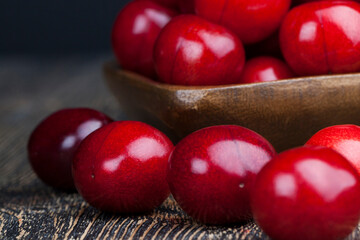 harvested ripe sweet cherries of red color
