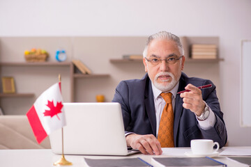 Old male employee working from home during pandemic