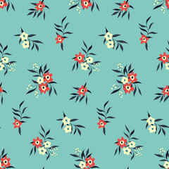 Seamless pattern with small floral bouquets on a blue background. Cute floral print with small red, white flowers, leaves. Botanical background design in winter colors. Vector.