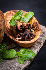 Сocoa  in wooden bowl and spices - cinnamon, cardamom, tubby. Candy set. Sweet life.