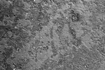 Texture of a concrete wall with cracks and scratches which can be used as a background