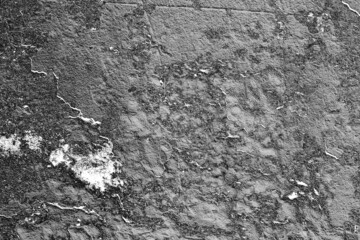 Texture of a concrete wall with cracks and scratches which can be used as a background