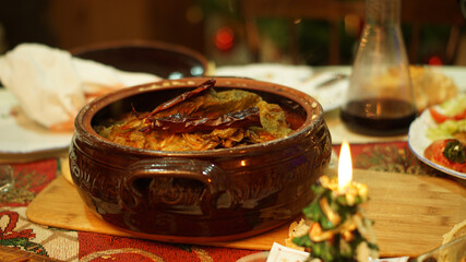 Traditional meal baked in a pot in the oven