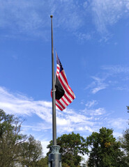 A USA flag flying half mast