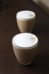 Two glasses of coffee with milk cappuccino or latte