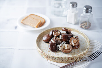 Gruzdi mushrooms with pickled onion and garlic.