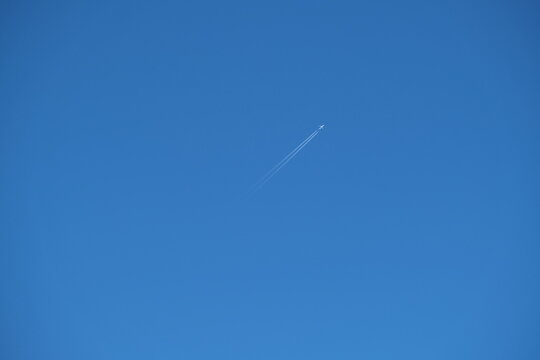 A Plane On Blue Sly