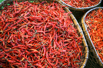 Fototapeta premium Dried red chilli, hot and spicy in bamboo basket.