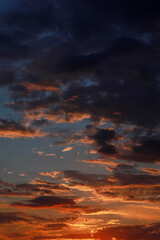 Fototapeta premium Gorgeous scenic of the sunrise or sunset with dark lining and cloud on the orange sky. Vibrant and Colorful background
