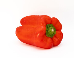 ripe with drops of water red pepper isolated on light background
