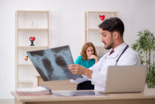 Young male doctor radiologist and female assistant working in th
