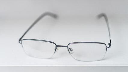 Corrective eyesight lenses. Close up of eyeglasses on the table.