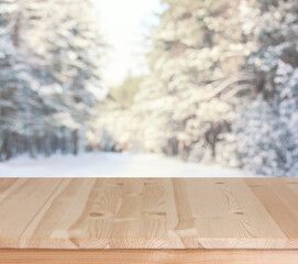 empty wooden table on a winter background, a mockup