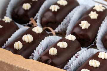 Homemade chocolate truffles with chocolate glaze. Closeup view. Box of tasty sweet chocolate truffles. 