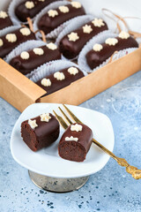 Homemade chocolate truffles with chocolate glaze. Closeup view. Box of tasty sweet chocolate truffles. 