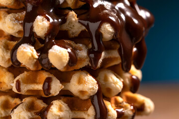 belgian waffles with chocolate sauce. sweet waffles for breakfast