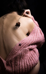 woman from behind with jacket and dried flower II