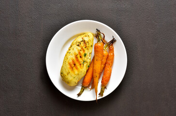 Roasted chicken breast with carrots