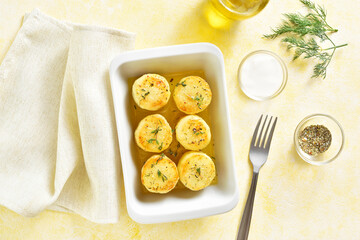 Fondant potatoes in baking dish