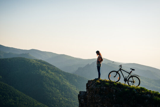 A trip by bike in mountain on the sunset. russia - sep, 2019