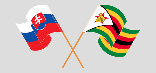 Crossed and waving flags of Slovakia and Zimbabwe