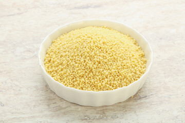Raw couscous in the bowl
