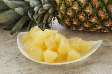 Marinated pineapple slices in the bowl