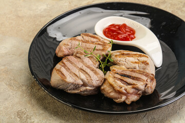 Grilled pork tenderlion with tomato sauce