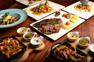 grilled beef dishes with vegetables souces and spices