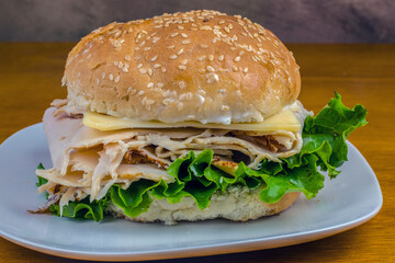 sliced chicken breast between sesame buns