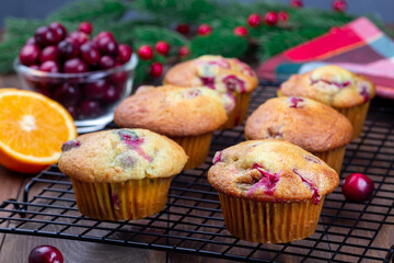 Cranberry orange muffins on cooling rack, horizontal