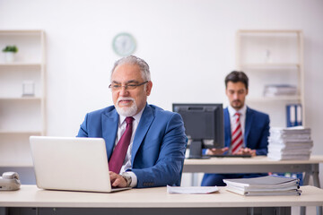 Fototapeta premium Two male colleagues working in the office