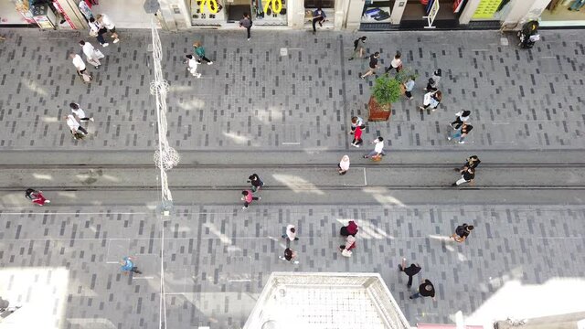 People are walking along the taksim district in Istanbul - Turkey.