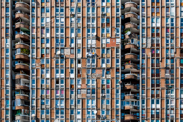Sarajevo, Bosnia-Hercegovina, 12 September 2015. Exterior view of a run-down apartment block on Bulevar Meše Selimovića still bearing the scars of the war and siege of Sarajevo.