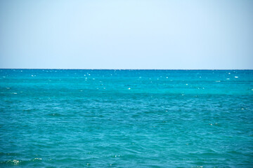 Fototapeta na wymiar Closeup seascape surface of blue sea water with small ripple waves