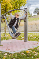 Caucasian girl using an apparatus in a senior exercise park. Concept of a fitness park...