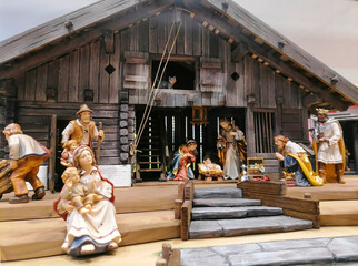 Traditional Christmas nativity scene with beautiful figures made out of wood. The birth of Jesus...