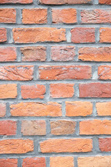 mur de briques oranges et rouges pouvant servir de texture ou d'arrière plan