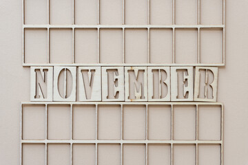 the month "november" in stencil font on paper