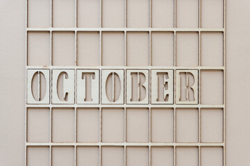 the month "october" in stencil font on paper