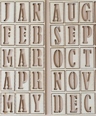 the months jan to may and aug to dec in stencil font on paper