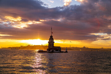 Maidens Tower at sunset, İstanbul. Beautiful clouds with blue sky. Historical light house of...