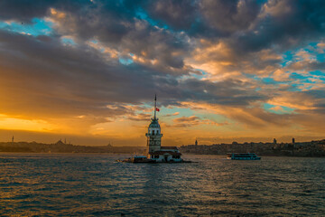 Fototapeta na wymiar Maidens Tower at sunset, İstanbul. Beautiful clouds with blue sky. Historical light house of İstanbul