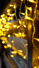 New Year! New Year's mood. Christmas. Yellow warm light. Home comfort. Garland. Smartphone background.